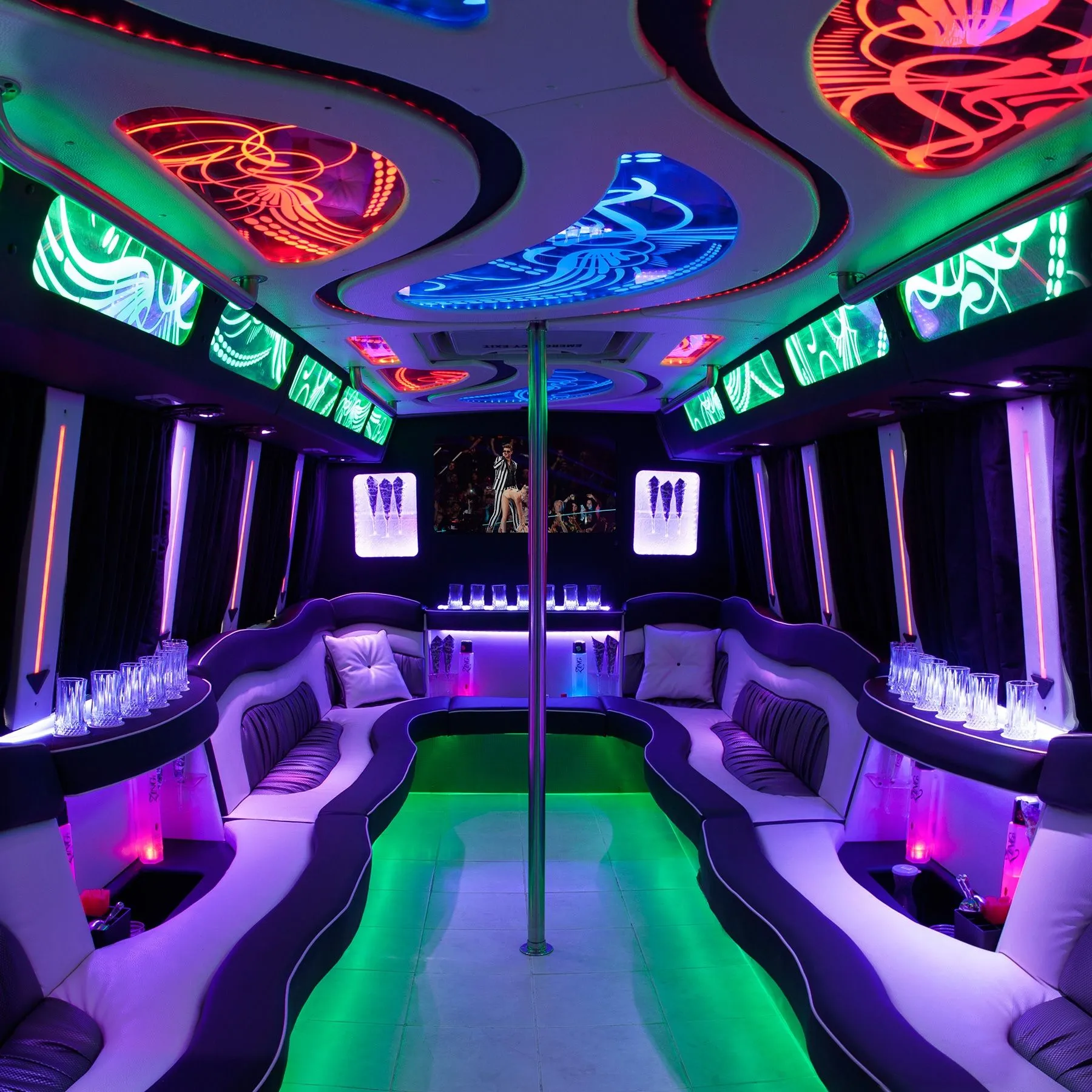 Interior of a Boston Elite Coach party bus with LED lighting and wraparound seating